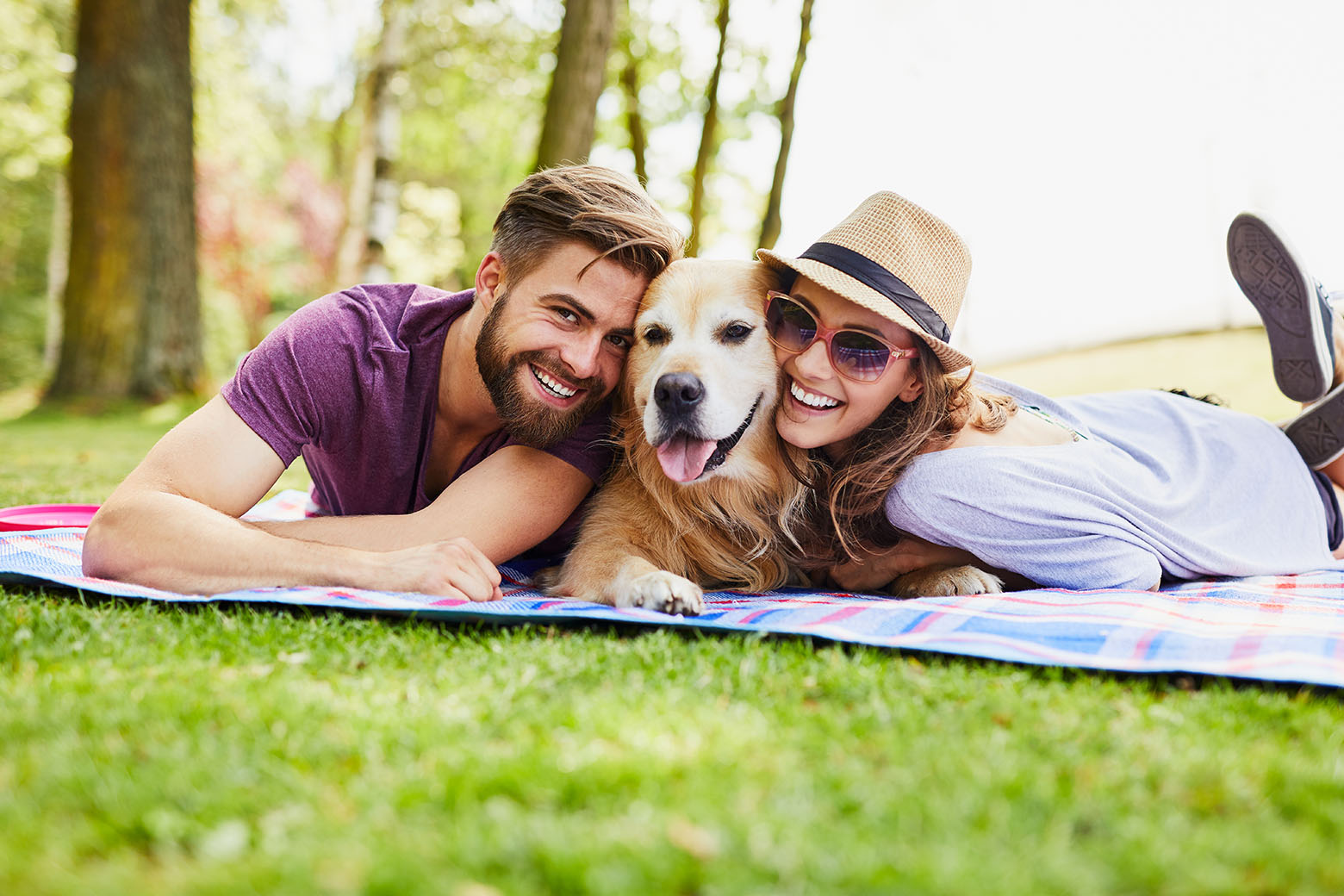 Couple and dog having a picnic