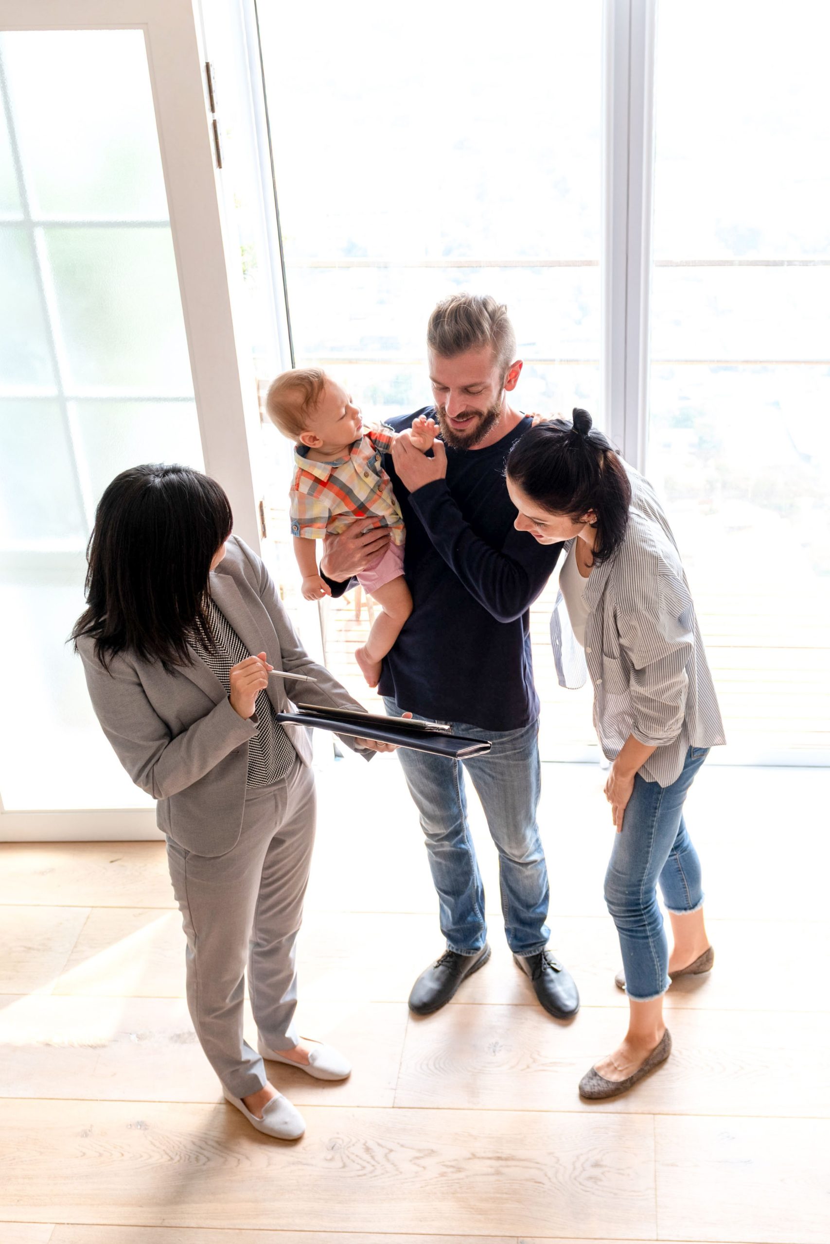Family Viewing Home from Above-Vertical
