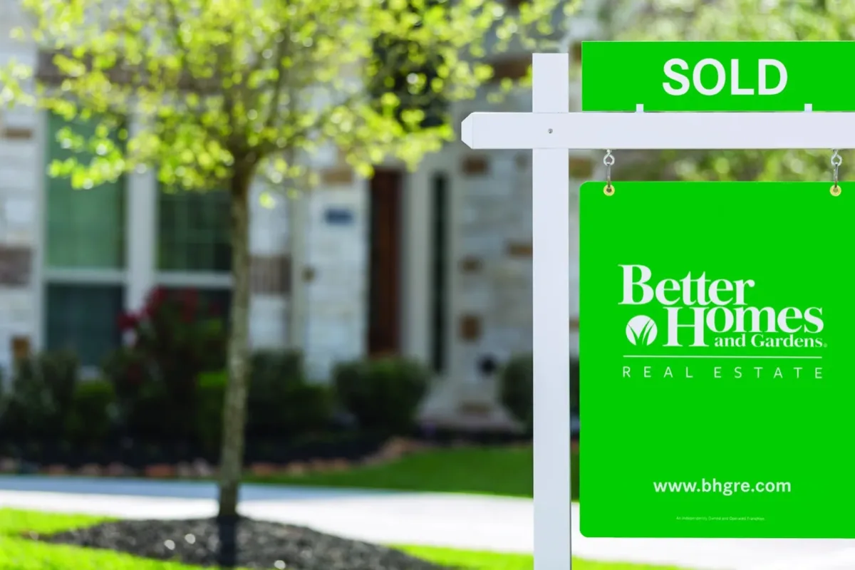 A sold sign in front of a home
